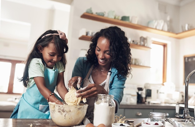 In truth a family is what you make it Shot of a woman baking at home with her young daughter