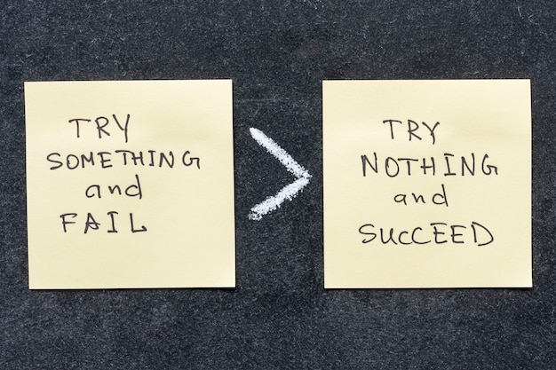 Try something and fail is more than try nothing and succeed phrase handwritten on sticker notes