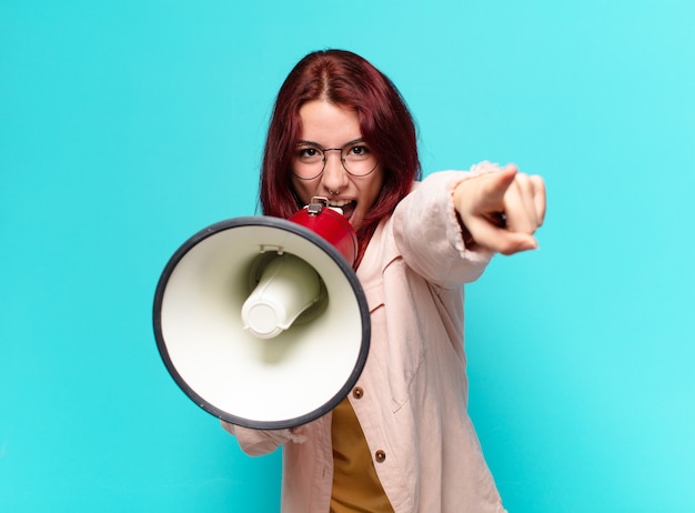 Tty woman shouting with a megaphone