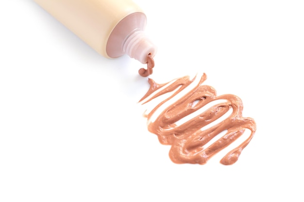 Tube of bb tone cream foundation isolated on white background