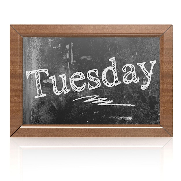 Tuesday text written on blackboard