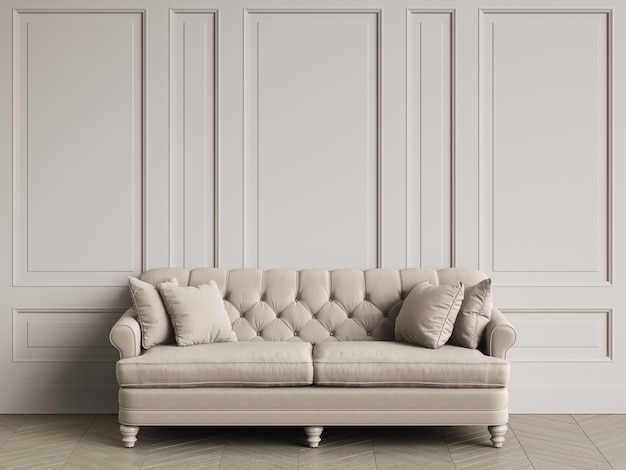 Tufted ivory color sofa in classic interior with copy space