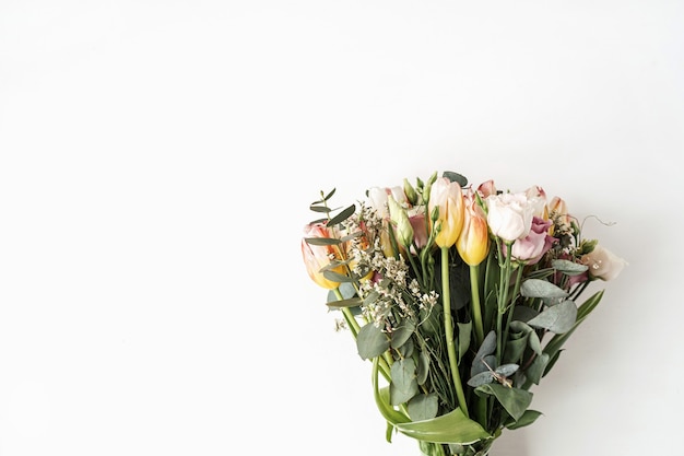 Tulip, eucalyptus flowers bouquet on white