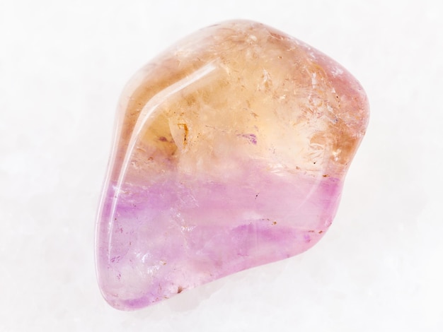 Tumbled Ametrine gemstone on white