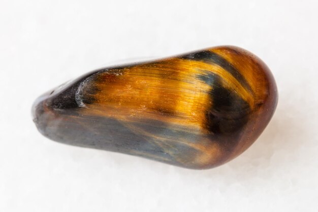 Tumbled tiger's eye and hawk's eye gemstone