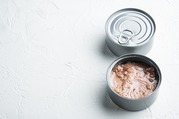 Tuna in a can, whole and chopped set, in tin can, on white