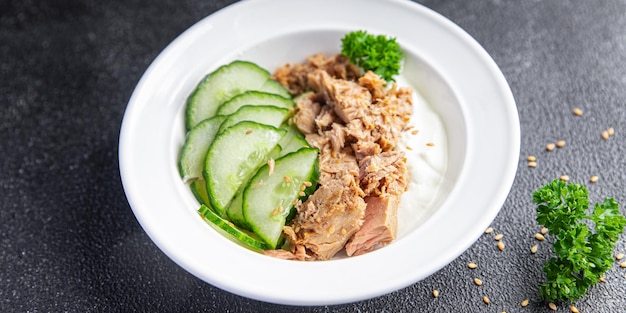 tuna salad, cucumber and yogurt or sour cream meal food snack on the table copy space food