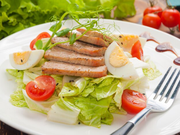 Tuna salad with egg, tomato and greens