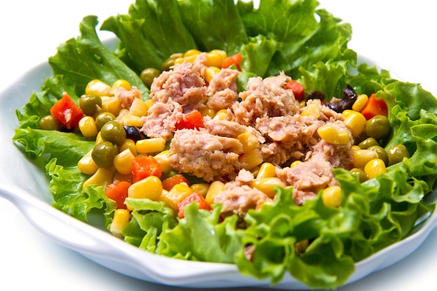 Tuna salad with mais on white shell dish