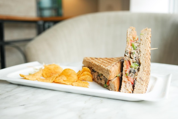 Tuna sandwich with mayonnaise on a plate on table