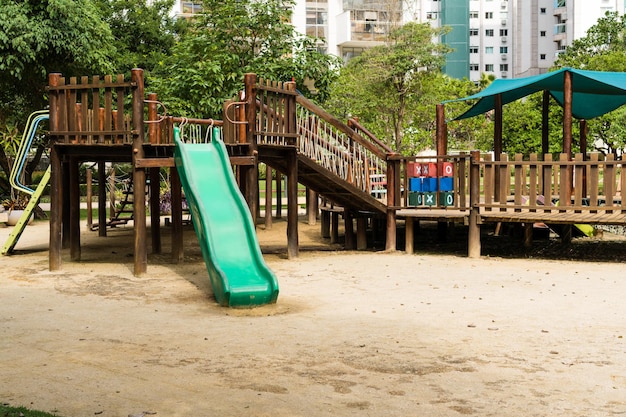 Tunnel and slider rustic and colorful playground for children in the park children's corner Recreation area