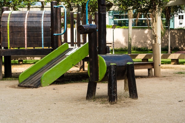 Tunnel and slider rustic and colorful playground for children in the park children's corner Recreation area