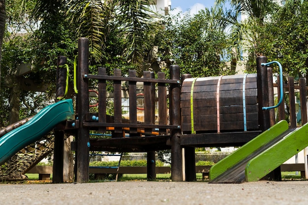 Tunnel and slider rustic and colorful playground for children in the park children's corner Recreation area