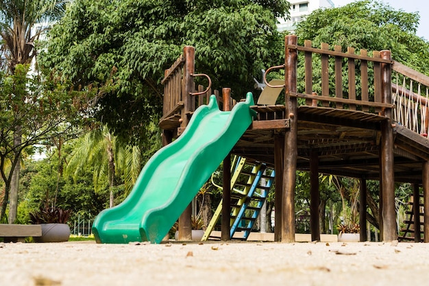 Tunnel and slider rustic and colorful playground for children in the park children's corner Recreation area