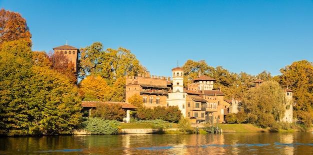 Turin Italy outdoors panorama with scenic Turin Valentino castle at sunrise in autumn