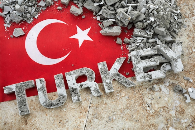 Turkey earthquake a background of the turkish flag and brick debris