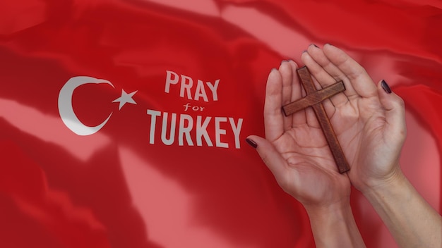 Turkey Earthquake concept on turkey flag and hand Praying for Turkey