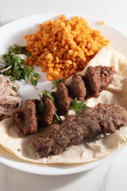 Turkish Adana Kebab with Vegetables on the Plate