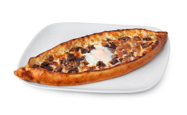 Turkish boatshaped flatbread pide isolated on white