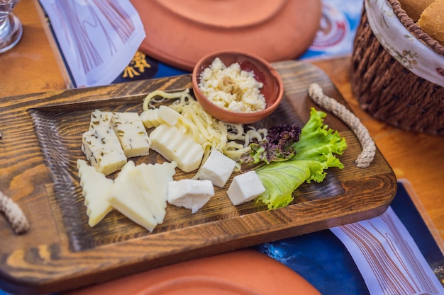 Turkish breakfast cheese pastries vegetables greens olives cheeses fried eggs spices jams honey tea