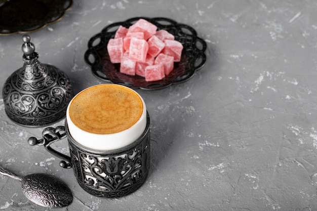 Turkish coffee. Oriental tableware with a pattern. Coffee beans, Turkish delight