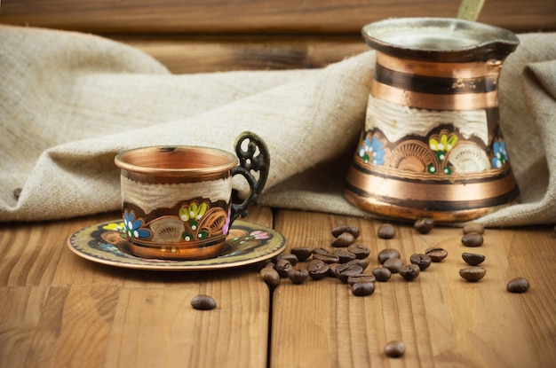 Turkish copper cup with coffee turk and coffee beans