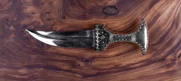 turkish dagger on wooden background