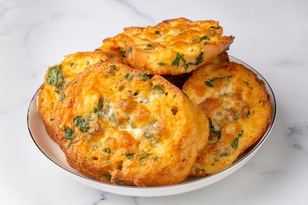 Turkish Egg Breads. It is called "Yumurtali Ekmek" in Turkish. French Toast. Turkish and Arabic Traditional Breakfast Baked or Fried Egg Bread. Egg bread with cheese and parsley.