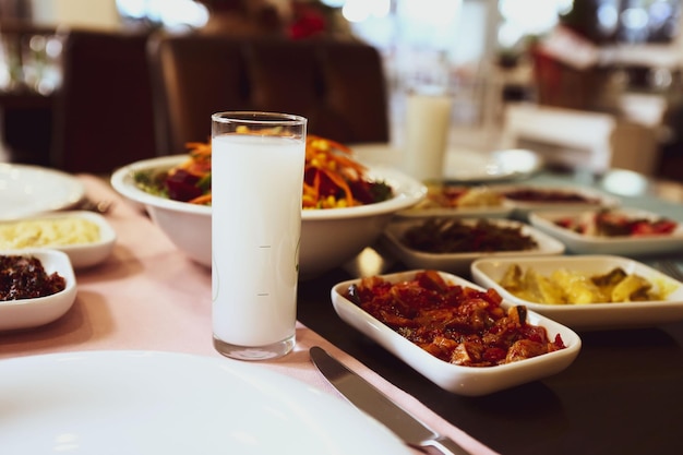 Turkish and Greek Traditional Dinning Table with Special Alcohol Drink Raki Ouzo and Turkish Raki i