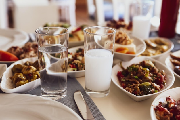 Turkish and Greek Traditional Dinning Table with Special Alcohol Drink Raki Ouzo and Turkish Raki i