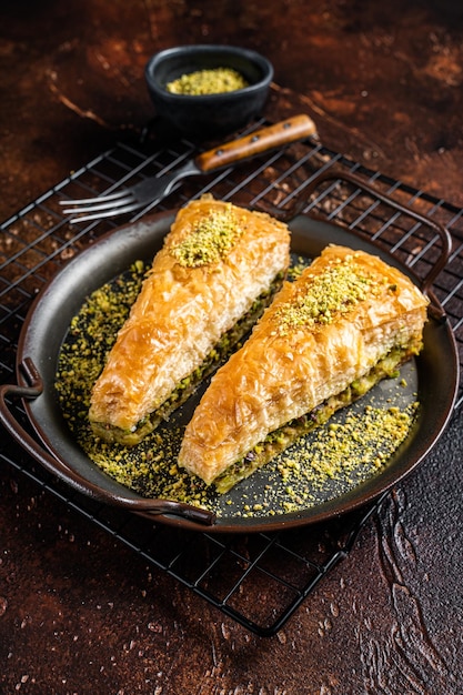 Turkish Havuc Dilim Baklava with pistachio Dark background Top view