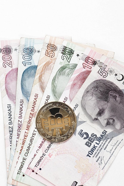 Turkish lira banknotes and bitcoin coin