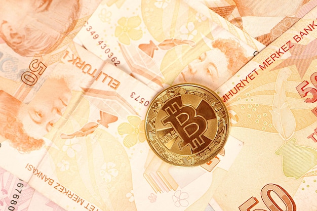 Turkish lira banknotes and bitcoin coin