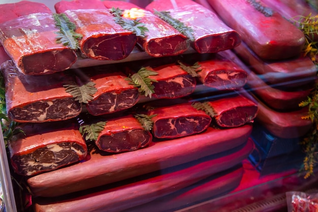 Turkish meze bacon stacked on top of each other in the delicatessen cabinet. close up