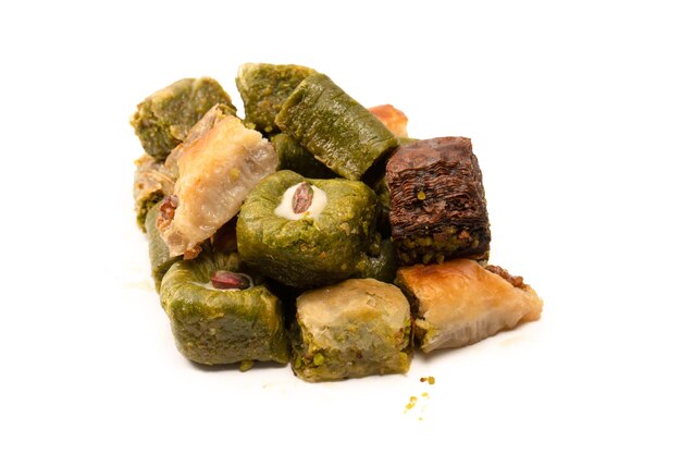 Turkish pistachio baklava isolated on a white background A variety of turkish sweet baklava