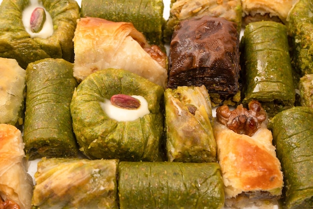 Turkish pistachio baklava isolated on a white background A variety of turkish sweet baklava