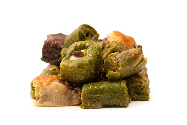 Turkish pistachio baklava isolated on a white background A variety of turkish sweet baklava