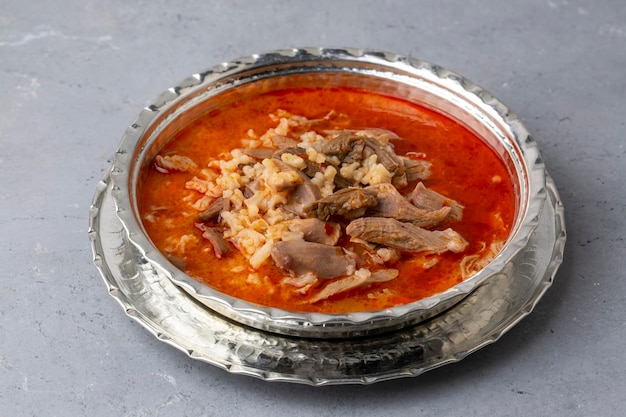 Turkish Soup Beyran with Lamb Meat, Rice, Chopped Garlic and Vinegar Sauce. Traditional Organic Food. Traditional soup of Gaziantep, Turkey. (Turkish name; Beyran corbasi)