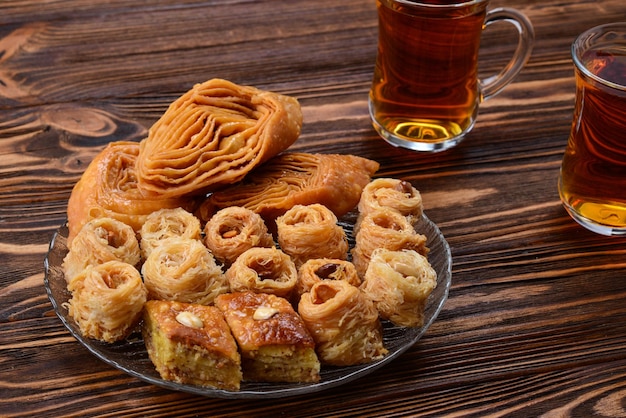 Turkish sweet baklava on plate with Turkish tea