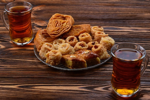 Turkish sweet baklava on plate with Turkish tea