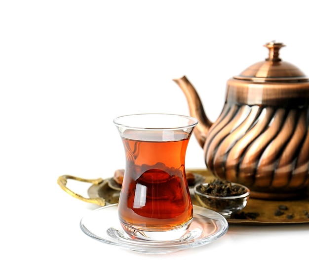 Turkish tea in traditional glass and metal teapot isolated on white