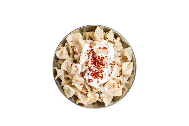 Turkish traditional manti with yoghurt and tomato sauce in a skillet Isolated on white background