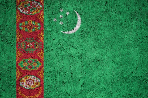 Turkmenistan flag painted on grunge wall