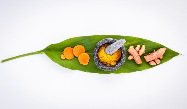 Turmeric on green turmeric leaf.