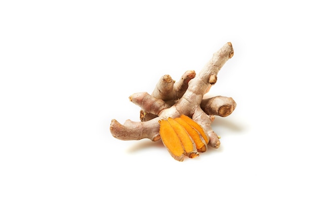 Turmeric head slides on a white background. Medicinal plants that are used in medicine and cooking are very common in Asia.