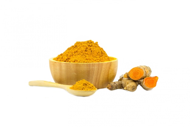 Turmeric powder and turmeric isolated on white 