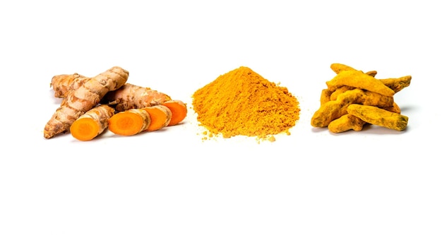 Turmeric rhizome and powder on white background