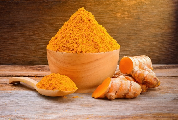 Turmeric roots with turmeric powder