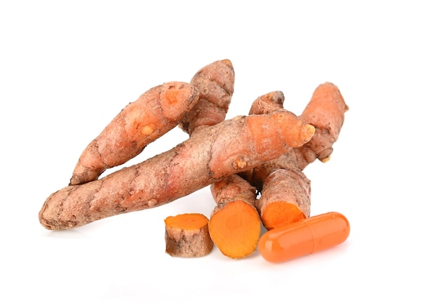 Turmeric and turmeric capsules isolated on white background