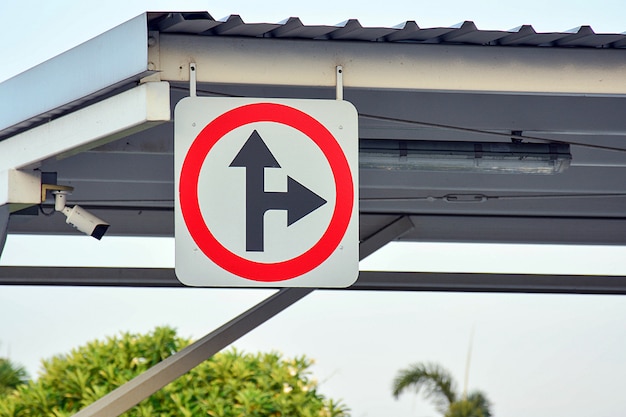 Turn right and go straight traffic sign in the park